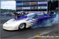 Kevin McCurdy Flat Out Dissolving The Slicks On His Burnout, Photo By GoneDragRacing.com